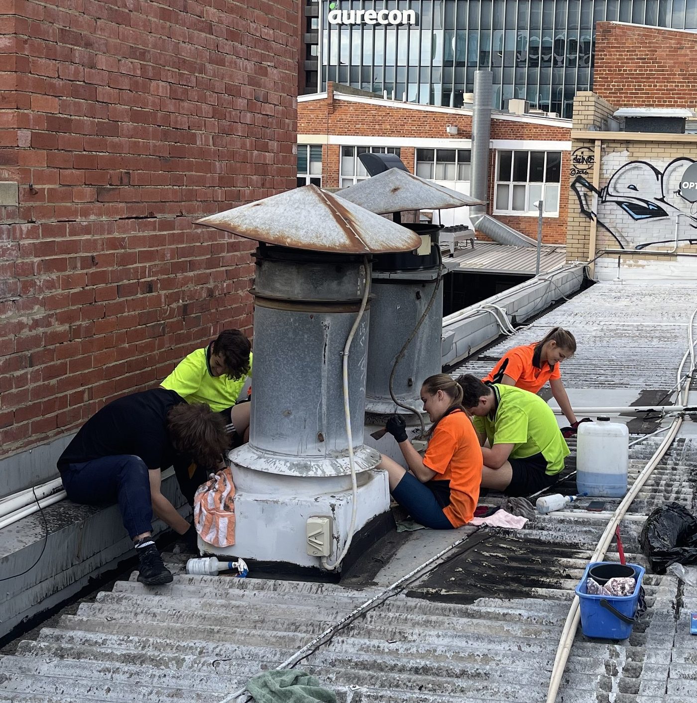 Cadin crew cleaning rooftop exhaust flues in Perth